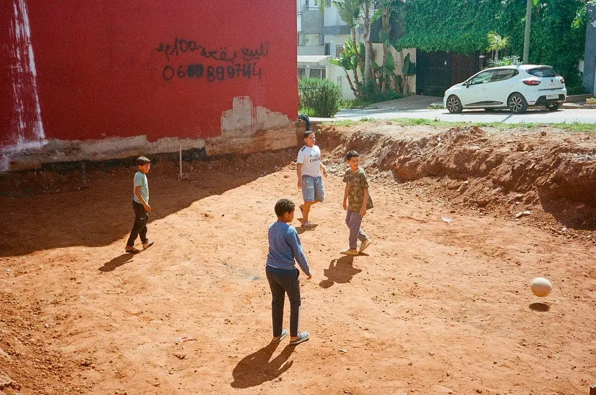 Image featuring person, walking, soil, and city